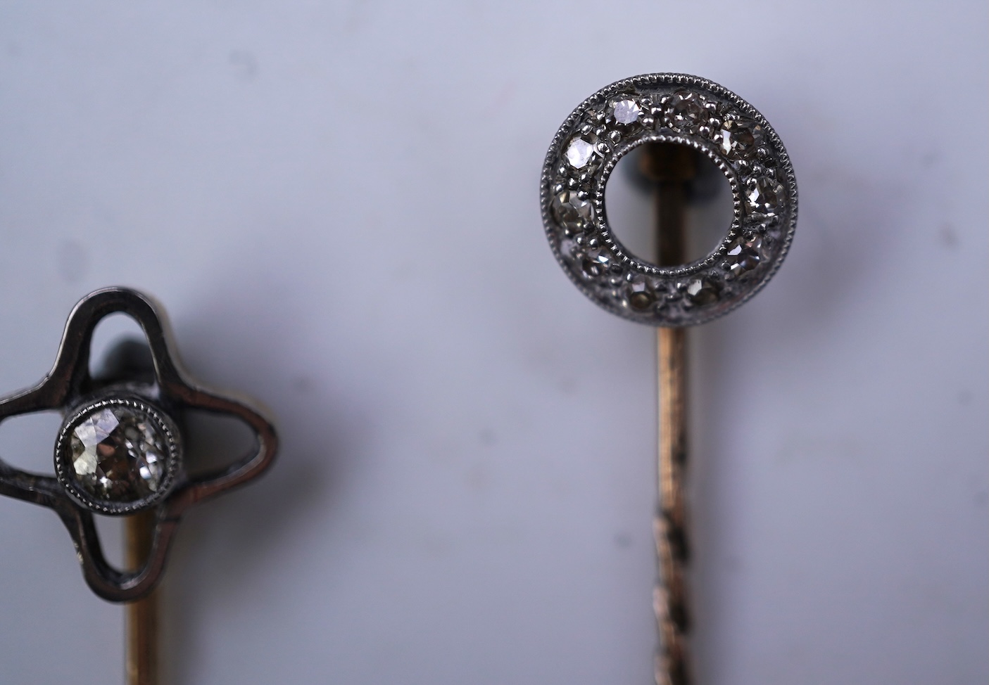 Two diamond stick pins, early 20th century